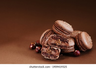 Close Up Of Chocolate Macarons With Hazelnut Praline Fiiling