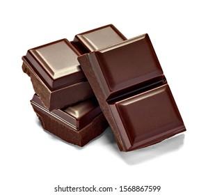 close up of chocolate pieces on white background - Shutterstock ID 1568867599