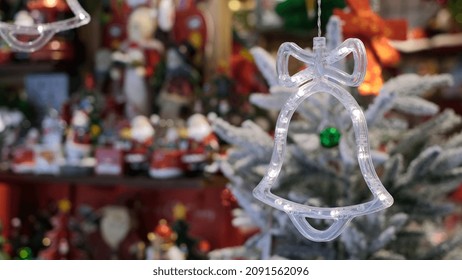 Close Up Of Chrismas Lights In Bell Shape, Symbol Of Holidays, Shopping For Xmas Tree And Home Decoration, New Year Eve Tradition