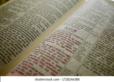 Close up of the Christian Bible open to 23rd Psalm, highlighted in pink. - Powered by Shutterstock