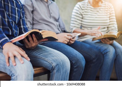 close up of christian group are reading and study bible together in Sunday school class room
