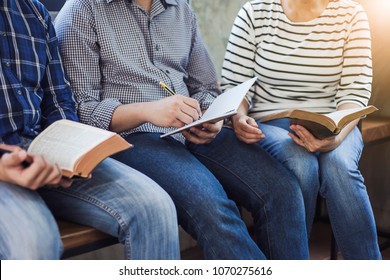 close up of christian group are reading and study bible together in Sunday school class room

