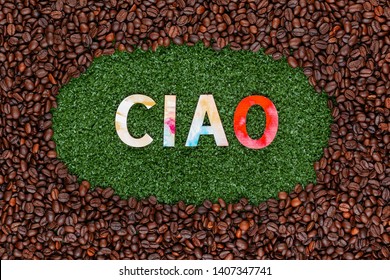 Close Up Of Ciao Word Made From Colorful Letters On Artificial Grass Surrounded By Roasted Coffee Beans