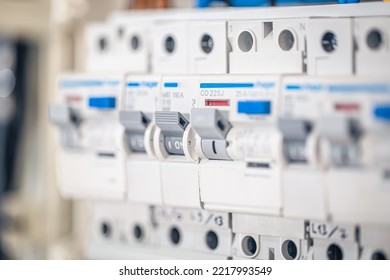 Close up circuit breakers and wire in control panel.