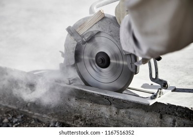 Close Up Of A Circular Saw Cutting A Concrete Slab 