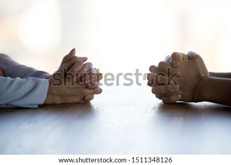 Close up clasped female hands of two businesswomen negotiate at table, confrontation concept, negotiators conflict, employees struggle for leadership at work, difficult job interview, hiring decision Stock photo © 