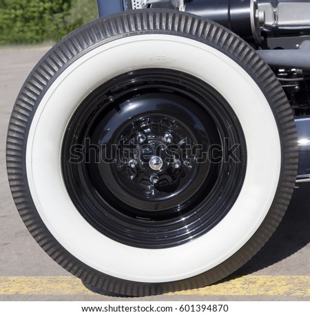 Close up of classic white sidewall tire.