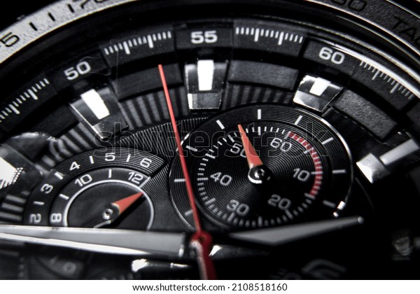 Close up of a classic wrist watch with\
chronograph and\
tachymeter