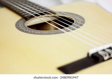 close up of classical guitar in another perspective in white background.