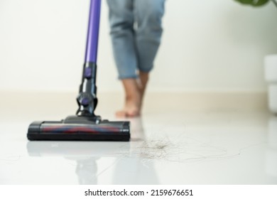 Close Up Of Cleaning Service Woman Worker Clean Living Room At Home. Beautiful Young Girl Housekeeper Cleaner Vacuuming Messy Dirty Floor With Hair Falls For Housekeeping Housework And Chores In House