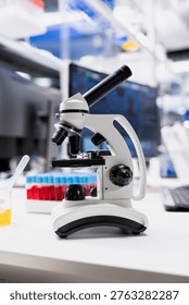 Close up of clinical microscope used for sample examination in empty hospital diagnostic lab. Optical device gear on medical laboratory workbench to be used for cellular analysis