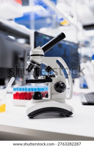 Close up of clinical microscope used for sample examination in empty hospital diagnostic lab. Optical device gear on medical laboratory workbench to be used for cellular analysis
