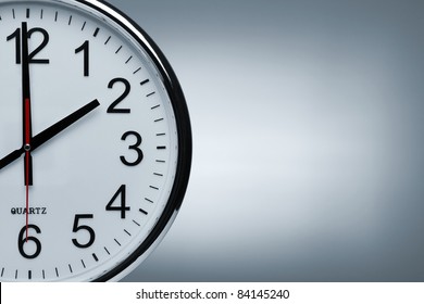 Close up of a clock isolated ob blue background with copy space