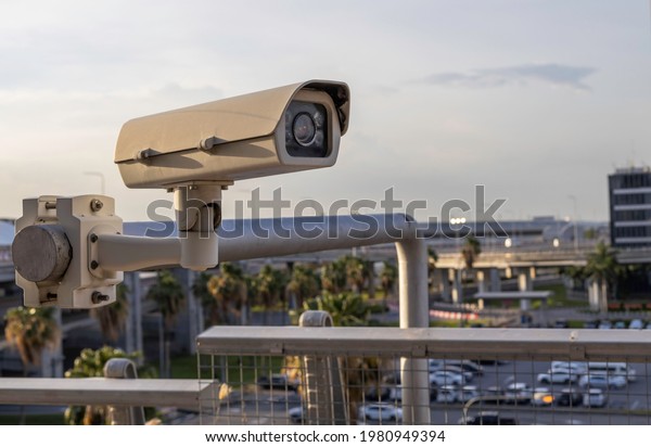 Close up of closed circuit cameras (CCTV)\
installed on airport steel\
poles.