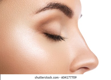 Close Up Of Closed Female Eye On White Background