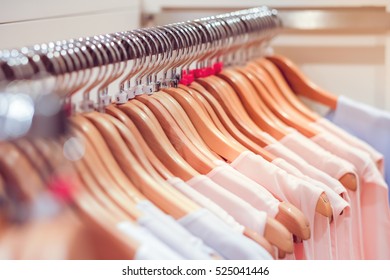 Close Up Clothes Hang On Clothes Rack In Clothing Store With Sweet Tone