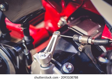 A Close Up Of The Clutch Cable On A Motorcycle Engine.