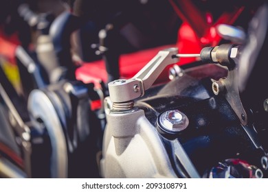 A Close Up Of The Clutch Cable On A Motorcycle Engine.