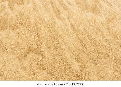Close up to Coarse brown Sand pile and Find Granular sand pile and fill Sand pile. used to make concrete , to create path , to create  floor.  texture, background and isolated. 