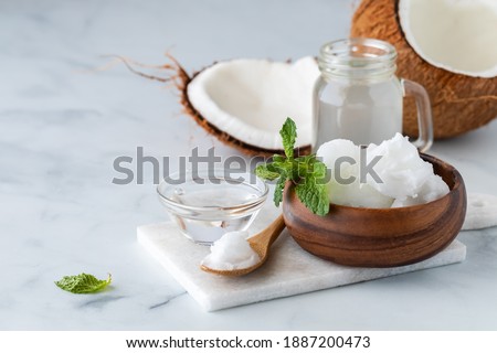 Similar – Image, Stock Photo Coconut oil in wooden bowl with spoon and moisturizing cream