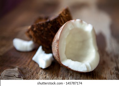 close up of a coconut on a wooden background