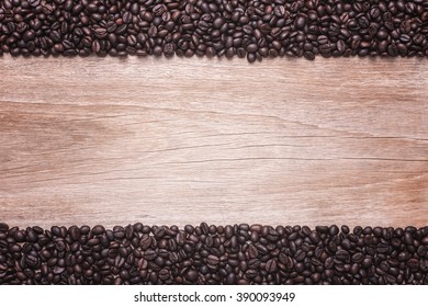 Close up coffee beans on wooden background, Composition with free space of wood - Shutterstock ID 390093949