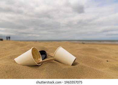 Close Up Coffee Cups Litter On The Beach