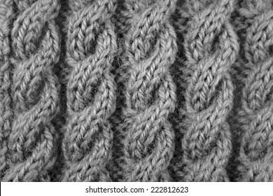 Close up of coiled rope cable knitting stitch - monochrome processing