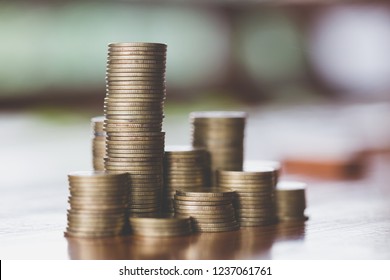 Close Up Of Coins To Stack Of Coins,  Business Growth Concept, There Is Money Coins To Stack Of Coins. Financial Risk.