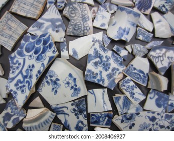 Close Up Of A Collection Of Broken Blue And White Chinese Porcelain Shards, Pieces.