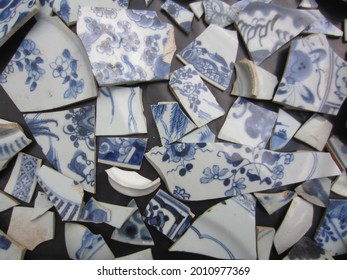 Close Up Of A Collection Of Broken Blue And White Chinese Porcelain Shards, Pieces.