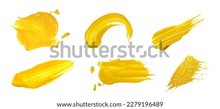 Close up collection of different yellow American mustard wet stains isolated on white background, top view, directly above