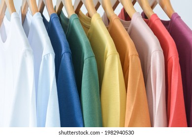 Premium Photo  Close up of t-shirts on hangers