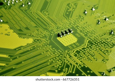 Close up of colored micro circuit board. Abstract technology background. Computer mechanism in details