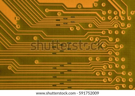 Close up of colored micro circuit board. Abstract technology background. Computer mechanism in details