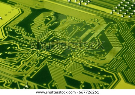 Close up of colored micro circuit board. Abstract technology background. Computer mechanism in details