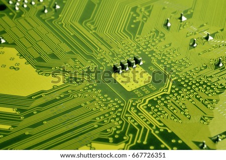 Close up of colored micro circuit board. Abstract technology background. Computer mechanism in details