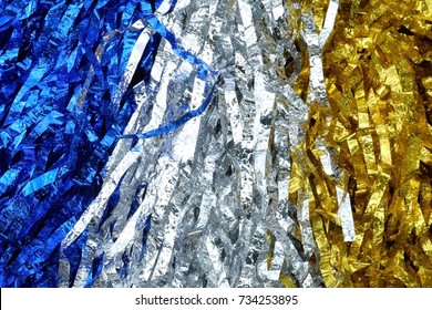 Close up colorful blue, silver and gold pompoms or pompoms image use for sport cheering background