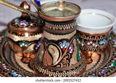 Close Up Of Colorful Coffee Pot In A Traditional Turkish Copper Coffee Set