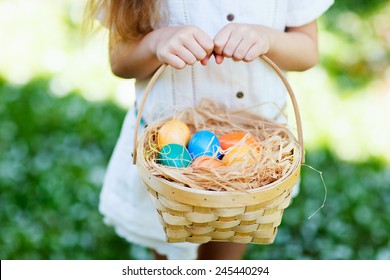 Close up of colorful Easter eggs in a basket - Shutterstock ID 245440294