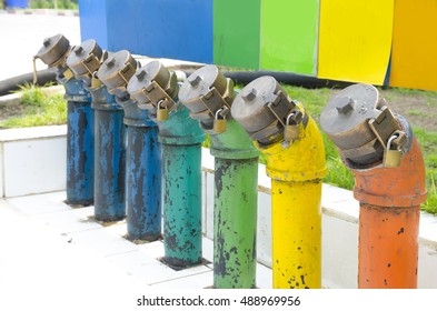 Close Up Colorful Of Gasoline Fuel Pipe And Valve At Transmission Point Of Underground Fuel Tank In Gas Station