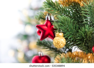 Close up of colorful ornaments on Christmas tree