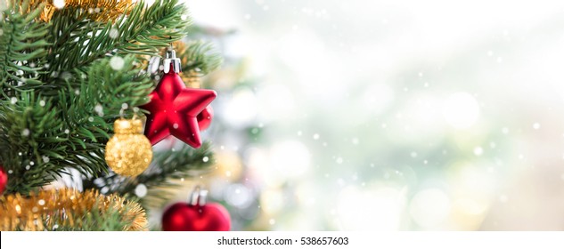 Close up of colorful ornaments on Christmas tree, panoramic banner background