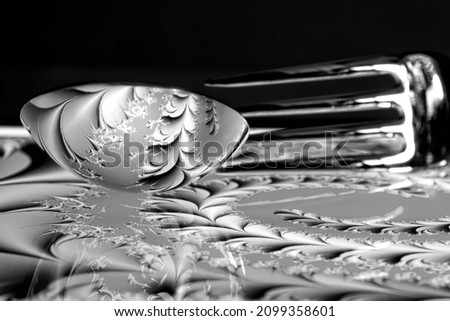 Close up of colorful reflective eating utensils on colorful patterned background