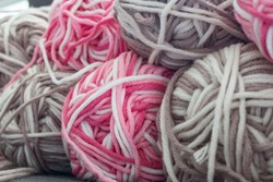 Close Up Colorful Yarn Texture Background, Dark Brown Cyclamen Pink And Pastel Creamy Beige Strains, Coiled In Ball Skein. Knitting And Crochet, Home Craft Work. Winter Color Combination For Styling.