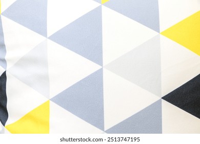 Close up of colourful triangular pattern design on pillow cushion, backgrounds and textures - Powered by Shutterstock - Get 15% off with code: PIKWIZARD15