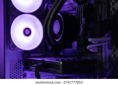 Close Up of Computer CPU Liquid Cooler Block with Neon Purple RGB Lighting - Powered by Shutterstock - Get 15% off with code: PIKWIZARD15