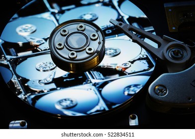 Close up of Computer Hard Drives Disc with various color effects and theme reflected on the disc surface. Wallpaper Background.
