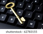 close up of computer with key. internet and network security concept.
