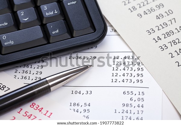 close up of computer\
keyboard and columns of figures for accounting and calculation of\
budget management